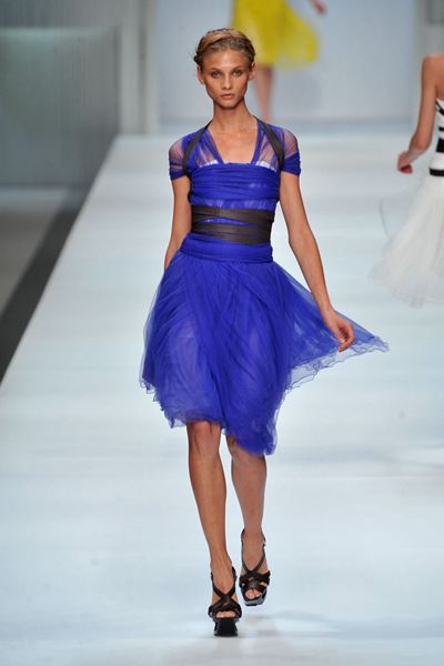 Blue, Fashion show, Hairstyle, Event, Dress, Shoulder, Human leg, Runway, Joint, One-piece garment, 