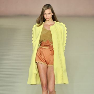 Clothing, Footwear, Yellow, Fashion show, Shoulder, Human leg, Runway, Joint, Outerwear, Style, 