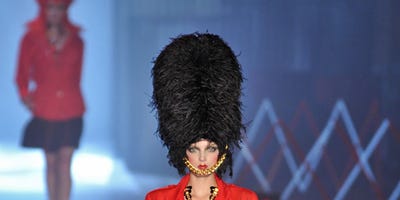 Clothing, Leg, Hairstyle, Human body, Human leg, Shoulder, Joint, Fashion show, Red, Outerwear, 