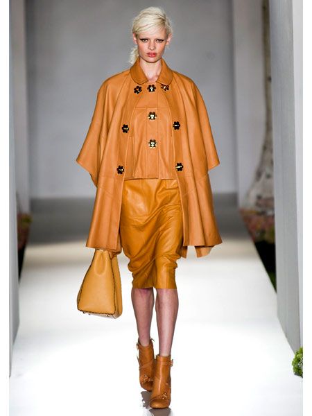 Brown, Sleeve, Textile, Joint, Outerwear, Fashion show, Style, Fashion model, Runway, Orange, 