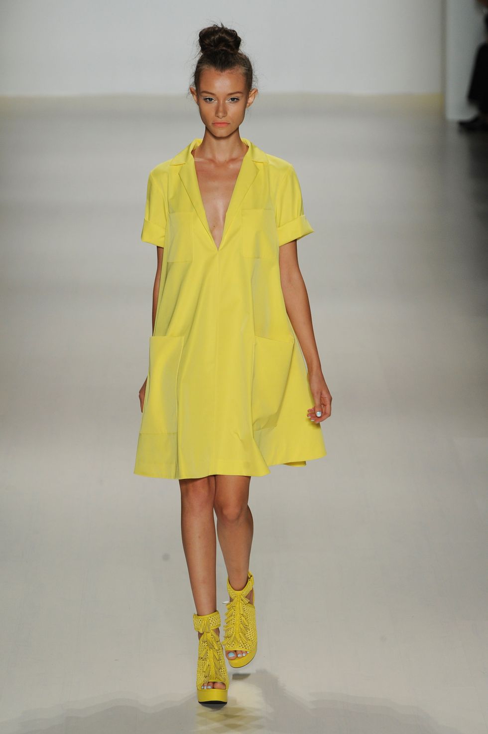 Clothing, Yellow, Sleeve, Shoulder, Joint, Fashion show, Style, Fashion model, One-piece garment, Dress, 