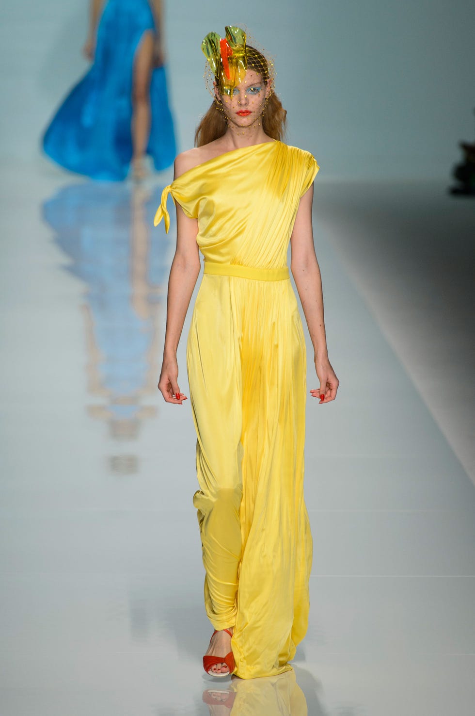 Yellow, Hairstyle, Shoulder, Fashion show, Dress, Style, Runway, Fashion model, Fashion, Costume design, 