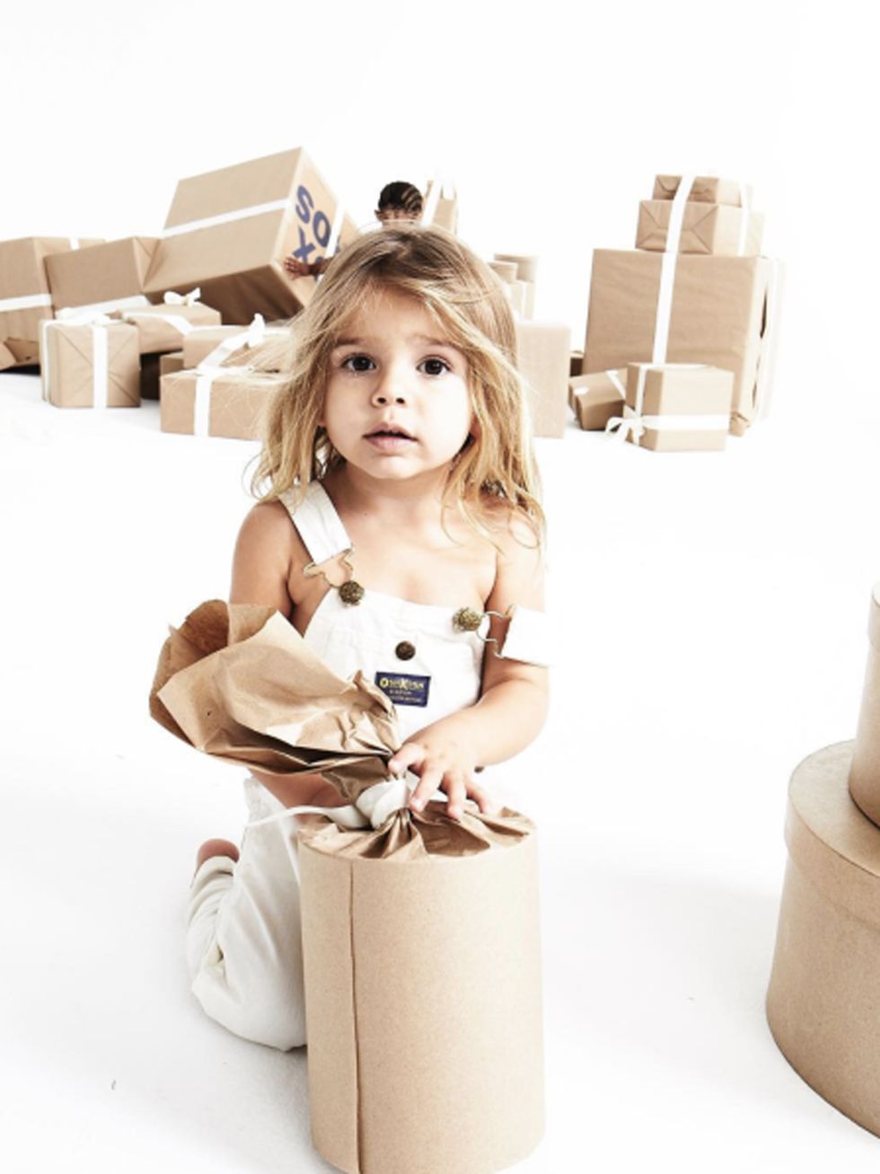 Shipping box, Cardboard, Khaki, Box, Beige, Tan, Carton, Brown hair, Packaging and labeling, Baby, 