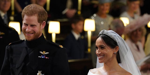 Smile, Bridal veil, Collar, Veil, Formal wear, Facial expression, Uniform, Tradition, Bridal clothing, Headpiece, 