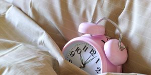 Pink, Watch, Peach, Alarm clock, Clock, Analog watch, Home accessories, Strap, Watch accessory, Still life photography, 