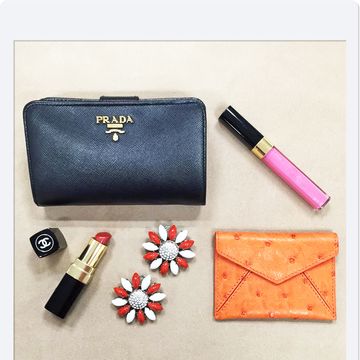 Stationery, Lipstick, Orange, Wallet, Paper product, Peach, Writing implement, Office supplies, Cosmetics, Material property, 