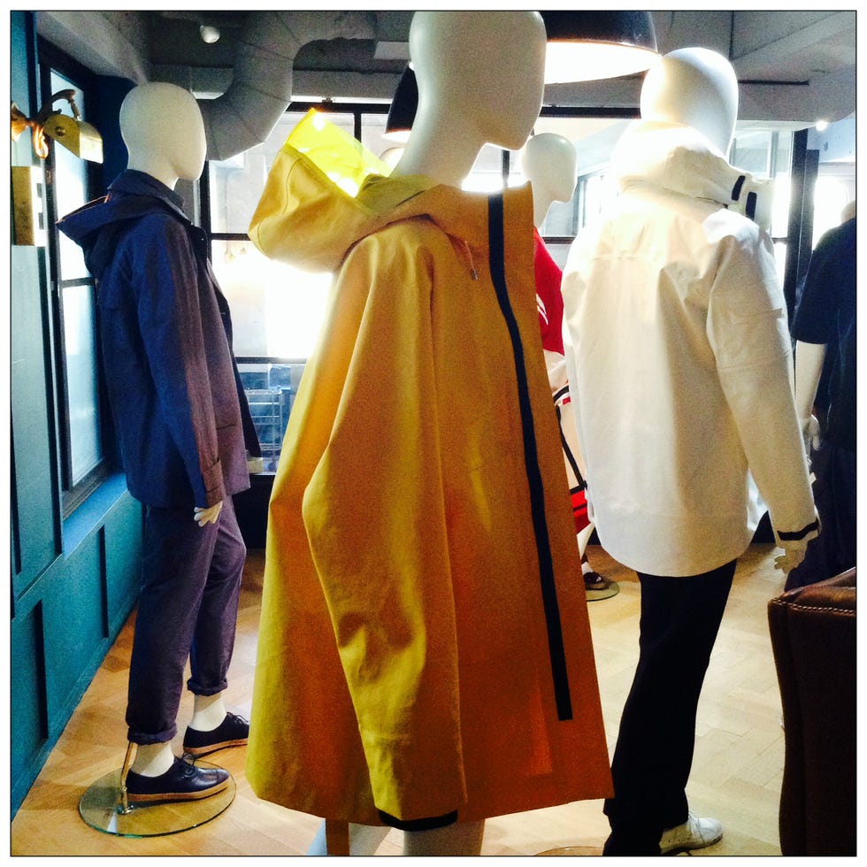 Yellow, Mannequin, Fashion, Street fashion, Retail, Display window, Back, Fashion design, Boutique, One-piece garment, 