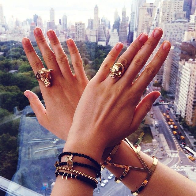 Finger, Skin, Nail, Wrist, Fashion accessory, Hand, Nail care, Amber, Jewellery, Tower block, 