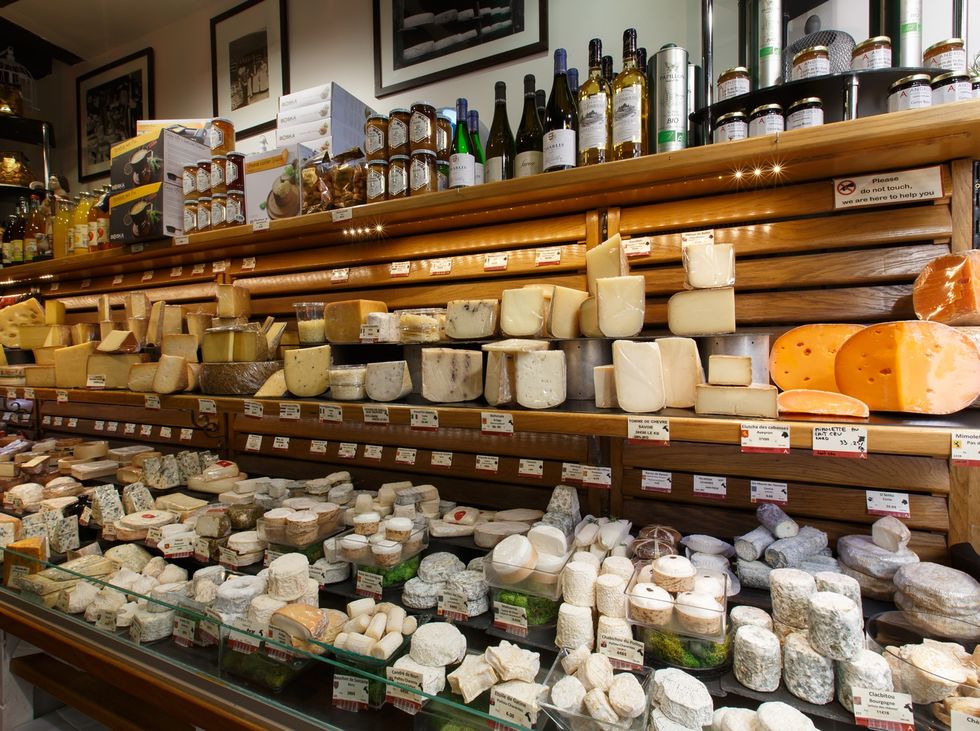Cheesemaking, Dairy, Food, Whole food, Delicacy, Wood, Grocery store, Pecorino romano, Inventory, Building, 