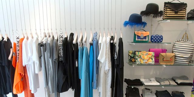 Textile, Clothes hanger, Fashion, Grey, Electric blue, Collection, Shelving, Fashion design, Shelf, Outlet store, 