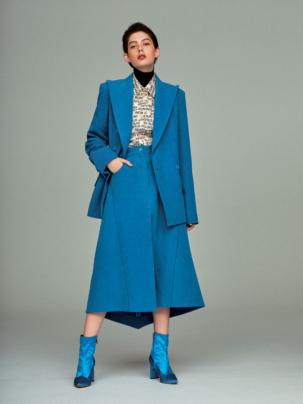 Clothing, Blue, Fashion model, Turquoise, Fashion, Overcoat, Coat, Aqua, Electric blue, Outerwear, 