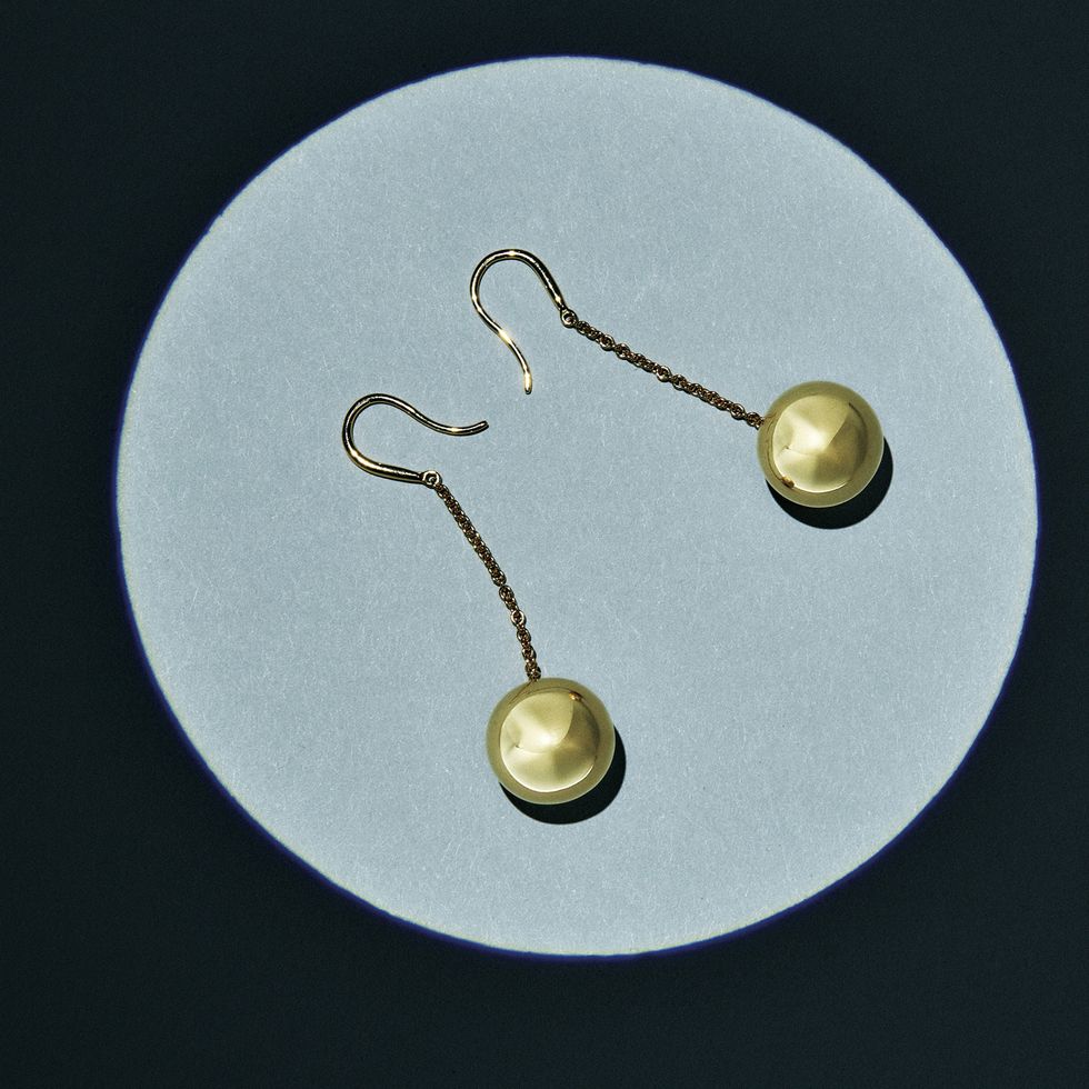 Earrings, Fashion accessory, Metal, Jewellery, Circle, Brass, Natural material, Body jewelry, Gold, Ball, 