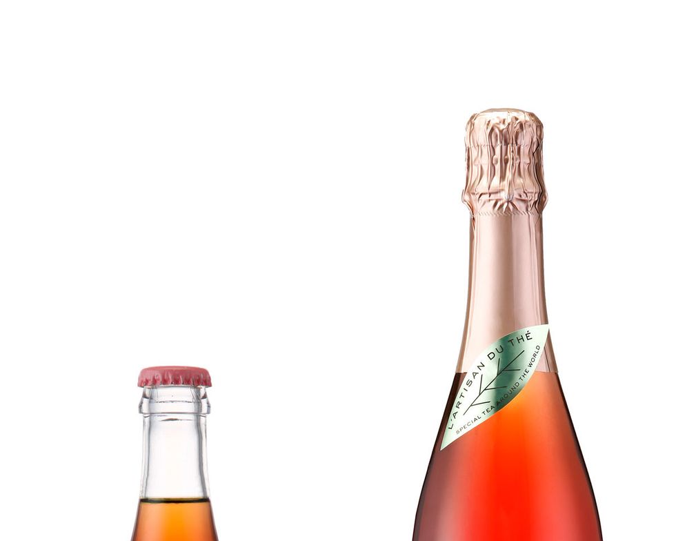 Product, Bottle, Liquid, Red, Glass bottle, Logo, Label, Bottle cap, Drink, Distilled beverage, 