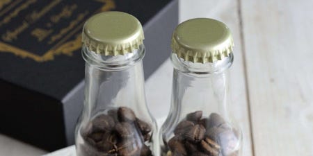 Brown, Bottle, Glass bottle, Bottle cap, Rectangle, Ingredient, Home accessories, Label, Packaging and labeling, Calligraphy, 