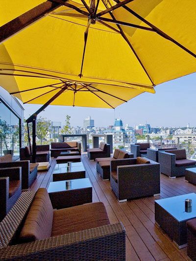 Yellow, Umbrella, Shade, Outdoor furniture, Roof, Outdoor table, Outdoor structure, studio couch, Patio, Armrest, 