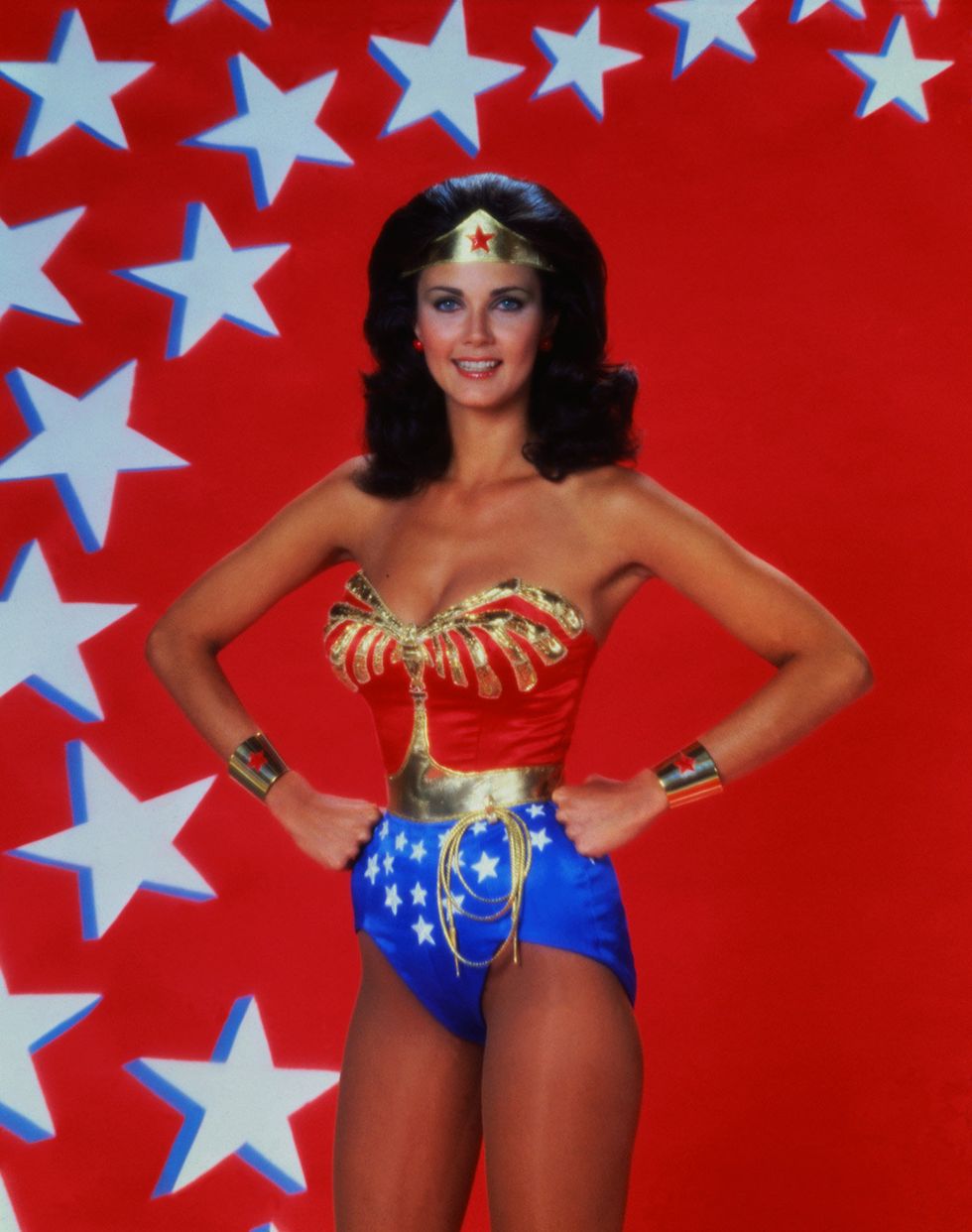 Mouth, Smile, Wonder Woman, Thigh, Abdomen, Costume, Electric blue, Waist, Costume accessory, Fictional character, 