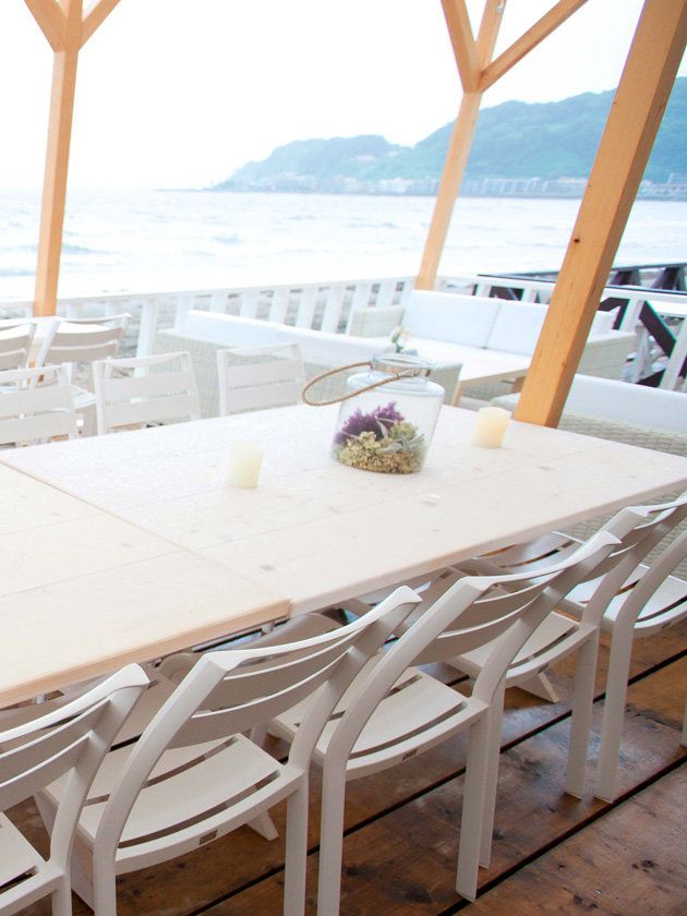 Wood, Table, Furniture, Chair, Restaurant, Outdoor table, Outdoor furniture, Tablecloth, Linens, Home accessories, 