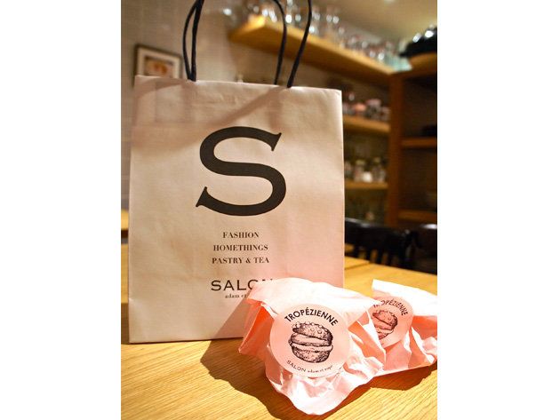 Paper bag, Shopping bag, Peach, Paper, Paper product, Brand, Money, Graphics, 