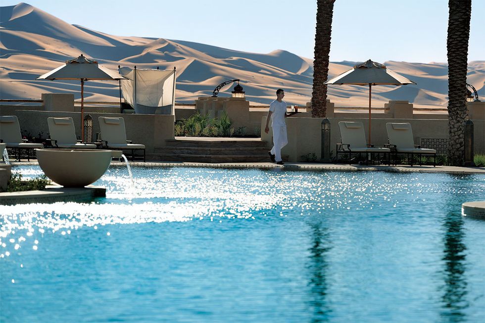 Swimming pool, Fluid, Water, Resort, Leisure, Real estate, Liquid, Shade, Roof, Umbrella, 