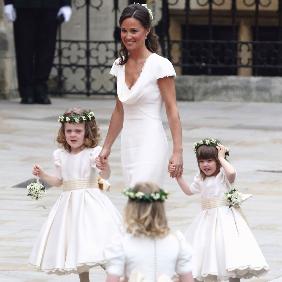 Child, Gown, Dress, White, Clothing, Bridal party dress, Wedding dress, Bridal clothing, Shoulder, Hairstyle, 