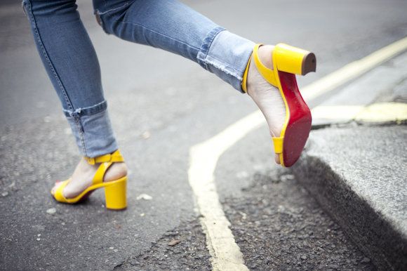 Yellow, Trousers, Human leg, Denim, Road surface, Jeans, Asphalt, Textile, Joint, Colorfulness, 
