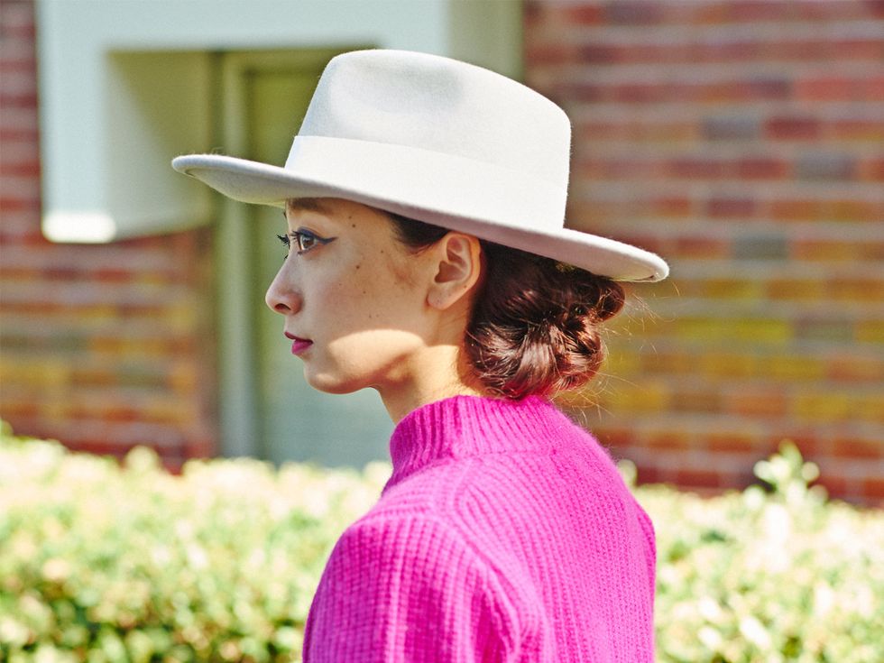 Clothing, Hat, Fashion accessory, People in nature, Sun hat, Headgear, Street fashion, Brick, Groundcover, Sweater, 