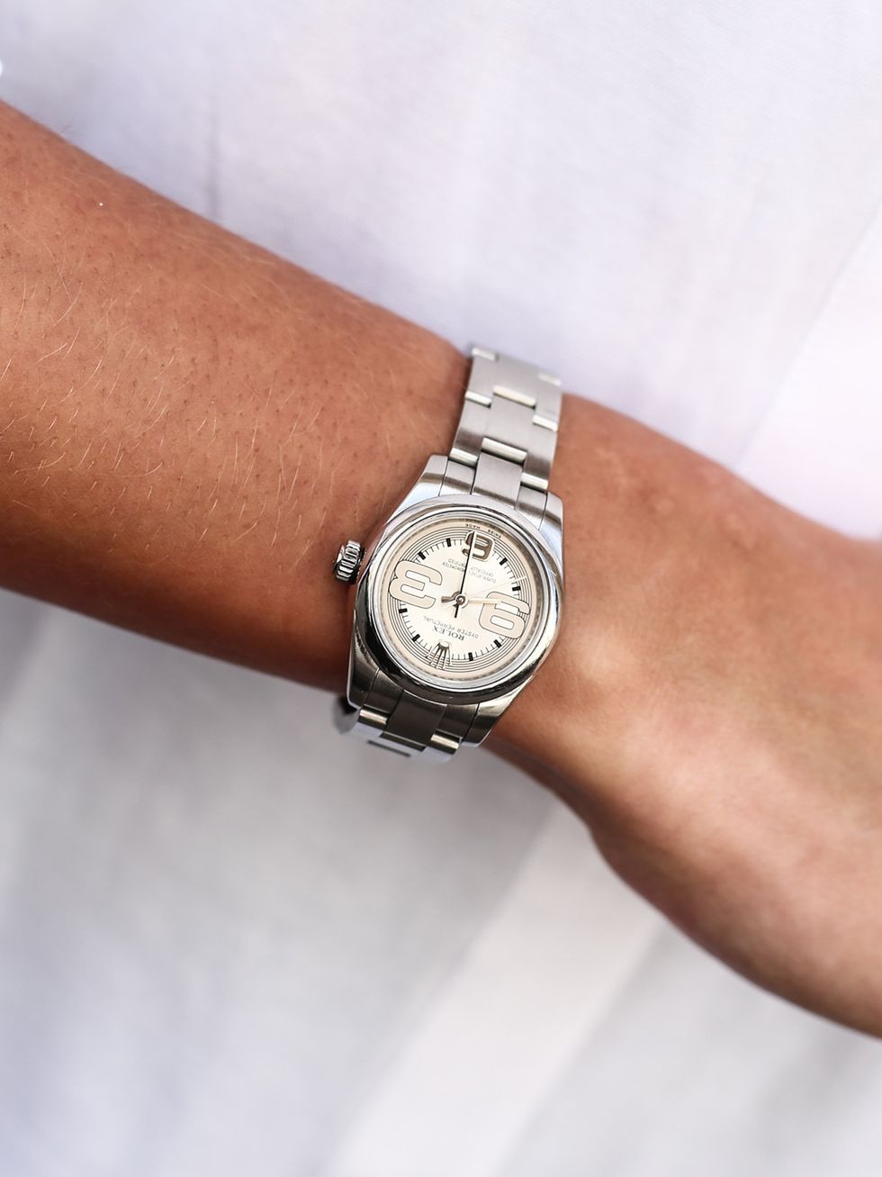 Product, Watch, Analog watch, Wrist, Photograph, White, Watch accessory, Font, Fashion accessory, Metal, 