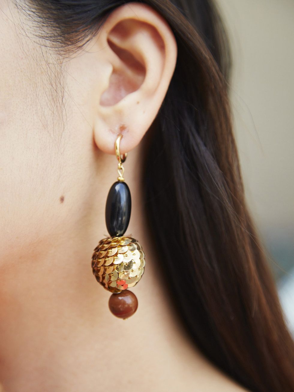 Earrings, Jewellery, Brown, Hairstyle, Fashion accessory, Body piercing, Body jewelry, Style, Amber, Natural material, 