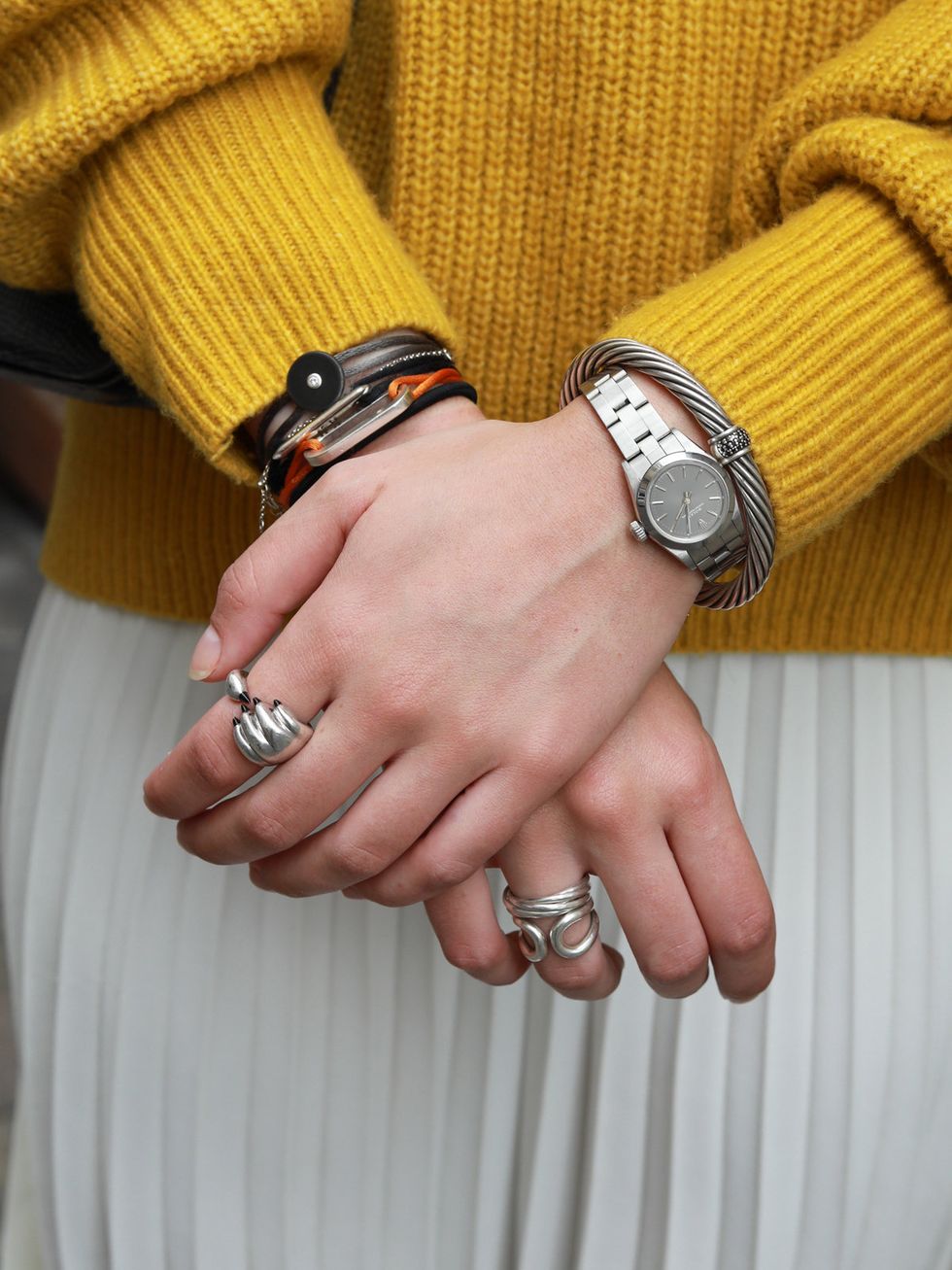 Yellow, Hand, Wrist, Finger, Nail, Fashion accessory, Interaction, Gesture, Holding hands, Jewellery, 