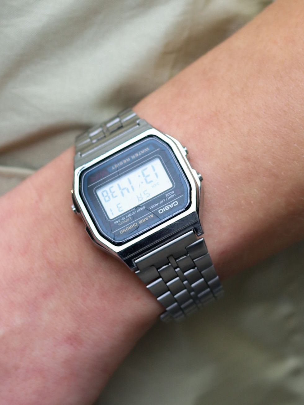 Watch, Wrist, Electronic device, Technology, Gadget, Watch accessory, Font, Metal, Azure, Black, 