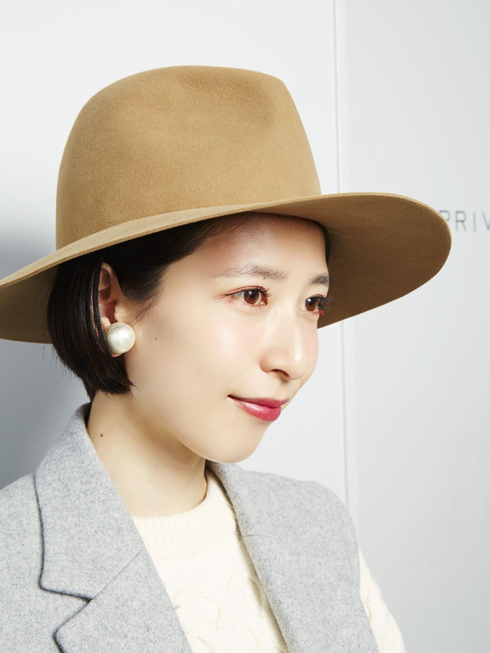 Clothing, Nose, Lip, Hat, Brown, Hairstyle, Skin, Chin, Collar, Fashion accessory, 