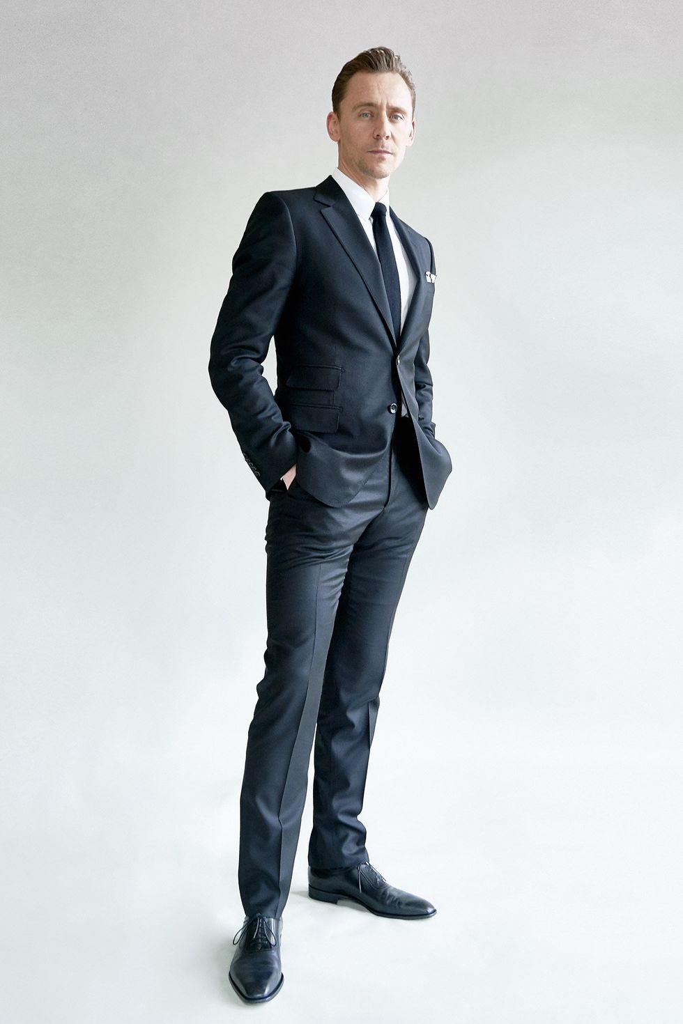Suit, Clothing, Standing, Formal wear, Tuxedo, Outerwear, Blazer, White-collar worker, Human, Tie, 