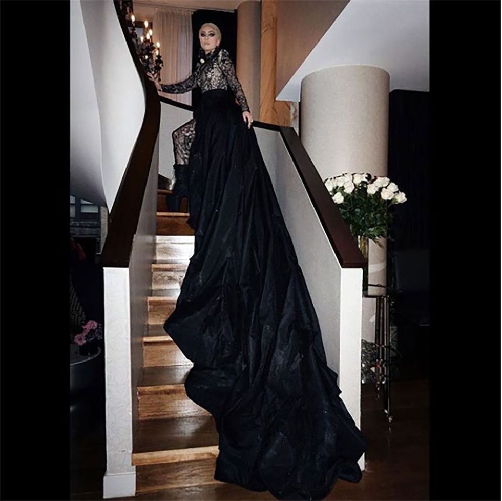 Clothing, Sleeve, Dress, Formal wear, Gown, Black, Fashion model, One-piece garment, Wood flooring, Haute couture, 