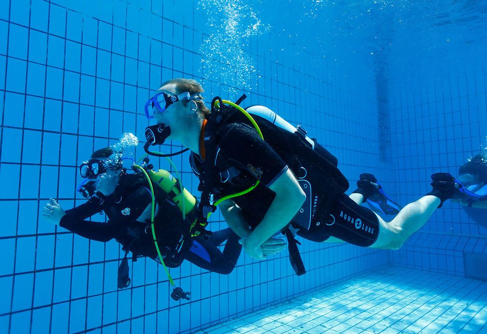 Underwater, Human, Underwater diving, Fun, Diving equipment, Fluid, Recreation, Organism, Personal protective equipment, Water, 