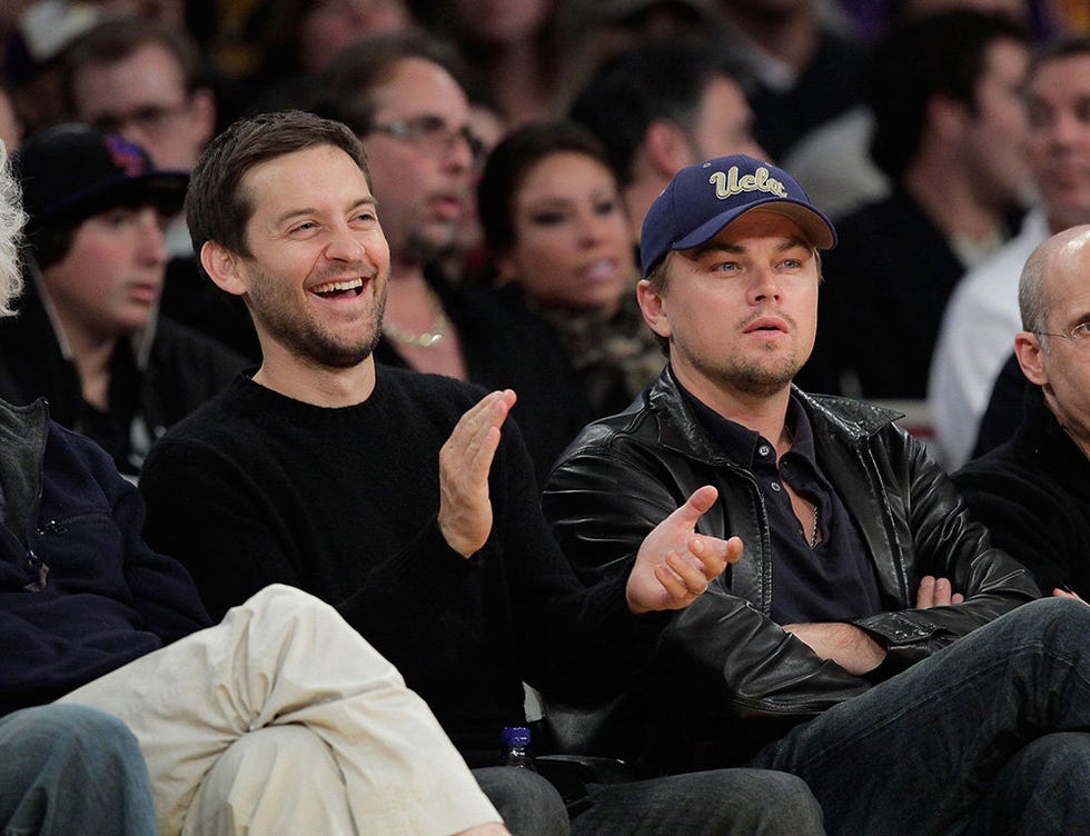 Face, Nose, People, Eye, Sitting, Facial hair, Social group, Cap, Crowd, Hat, 