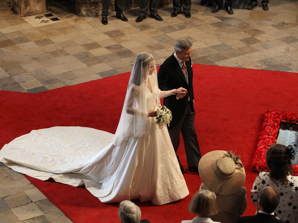 Gown, Wedding dress, Dress, Bride, Bridal clothing, Carpet, Bridal accessory, Marriage, Flooring, Ivory, 