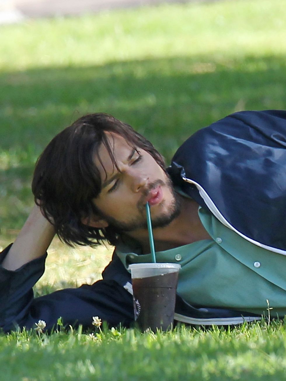 Grass, Drink, People in nature, Black hair, Drinking, Long hair, Lawn, Meadow, Non-alcoholic beverage, Cup, 