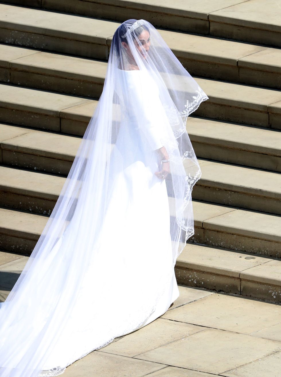 Bridal veil, Veil, Textile, Photograph, Bridal clothing, Wedding dress, Bridal accessory, Bride, Stairs, Gown, 