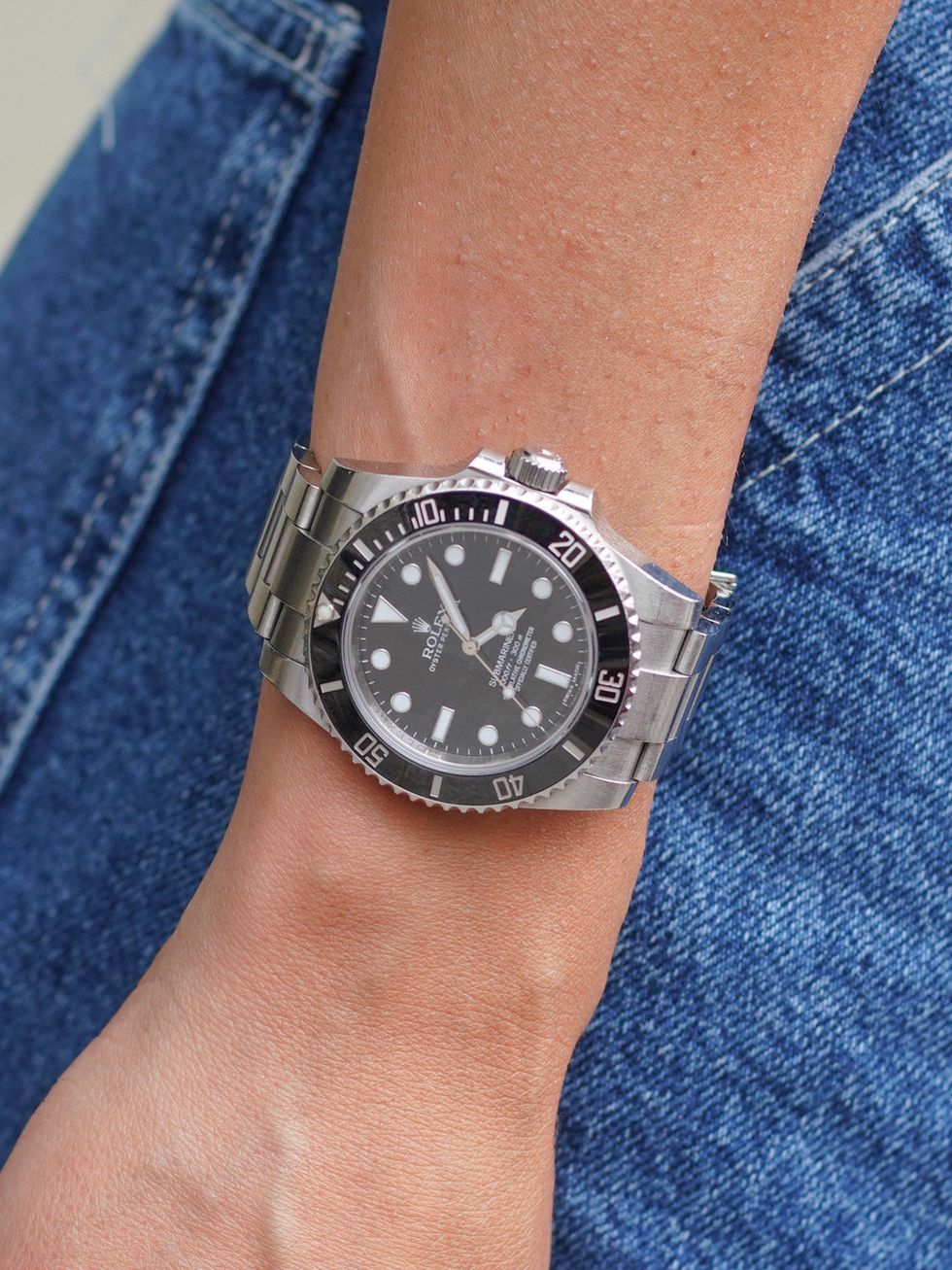 Wrist, Watch, Analog watch, Joint, Denim, Watch accessory, Font, Fashion, Azure, Black, 