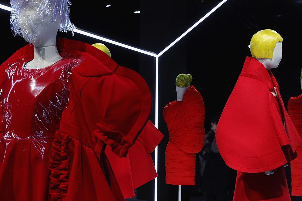 Red, Outerwear, Cope, Costume, Mannequin, Display window, Jacket, Tourist attraction, Fictional character, Cardinal, 