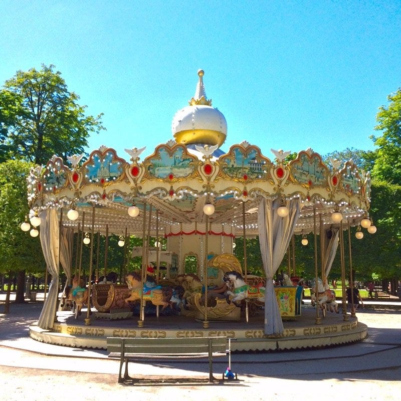 Tree, Carousel, Amusement park, Amusement ride, Shade, Nonbuilding structure, Park, Decoration, Fair, Festival, 