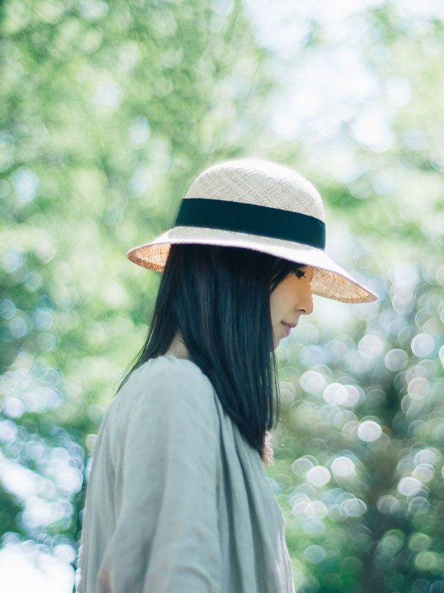 Clothing, Hat, Green, Summer, People in nature, Headgear, Fashion accessory, Street fashion, Costume accessory, Sun hat, 