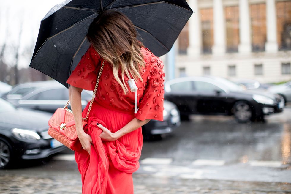 Street fashion, Red, Umbrella, Rain, Fashion, Vehicle, Car, Fashion accessory, Outerwear, Vehicle door, 