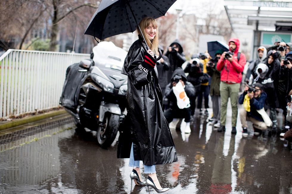Rain, Umbrella, Street fashion, Water, Precipitation, Event, Fashion accessory, Costume, Pedestrian, Street, 