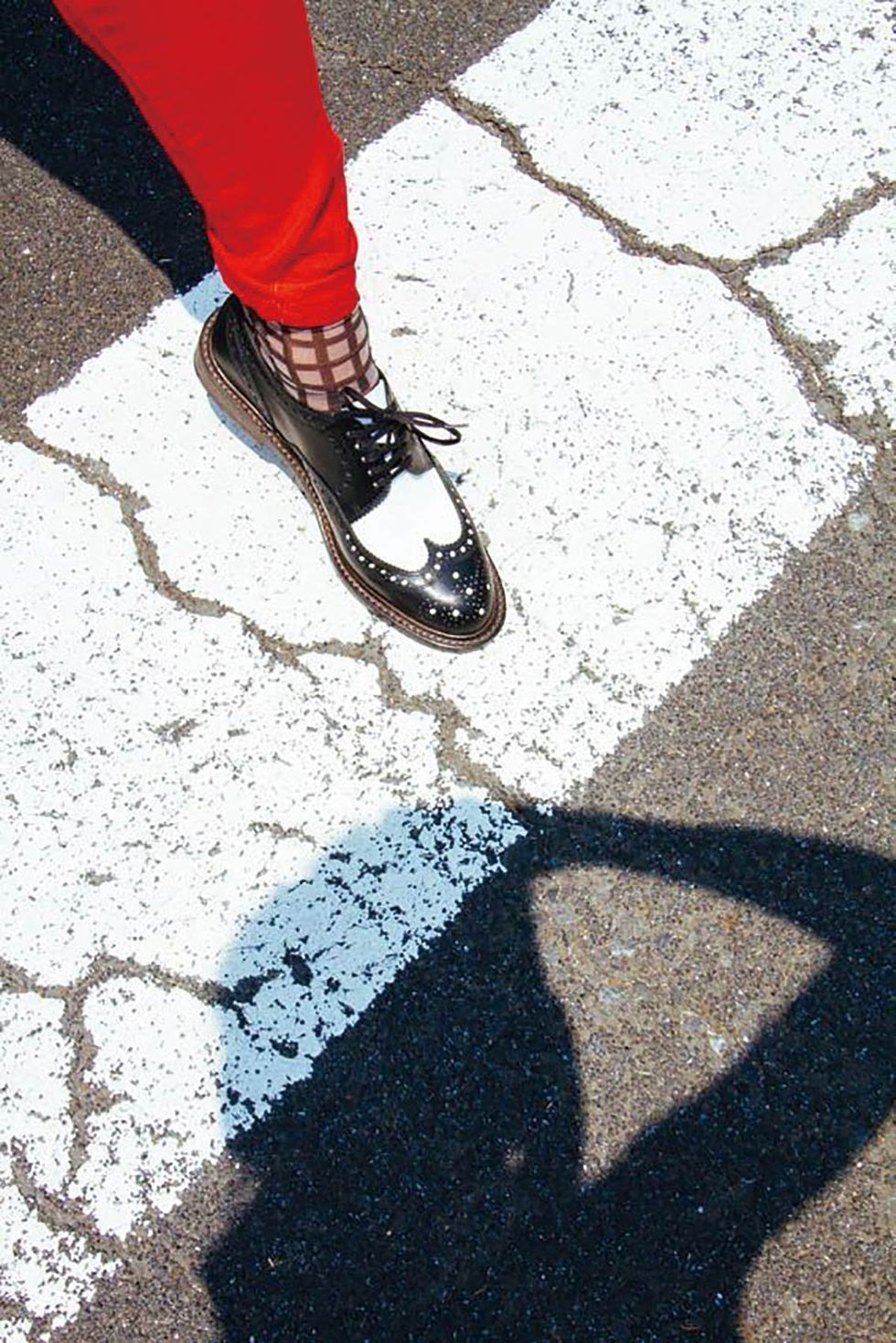 Road surface, Human leg, Shoe, Asphalt, Shadow, Grey, Street fashion, Tar, Walking shoe, Ankle, 