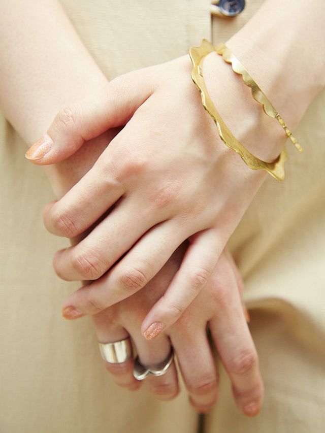 Finger, Skin, Wrist, Hand, Nail, Thumb, Gesture, Nail care, Beige, Holding hands, 