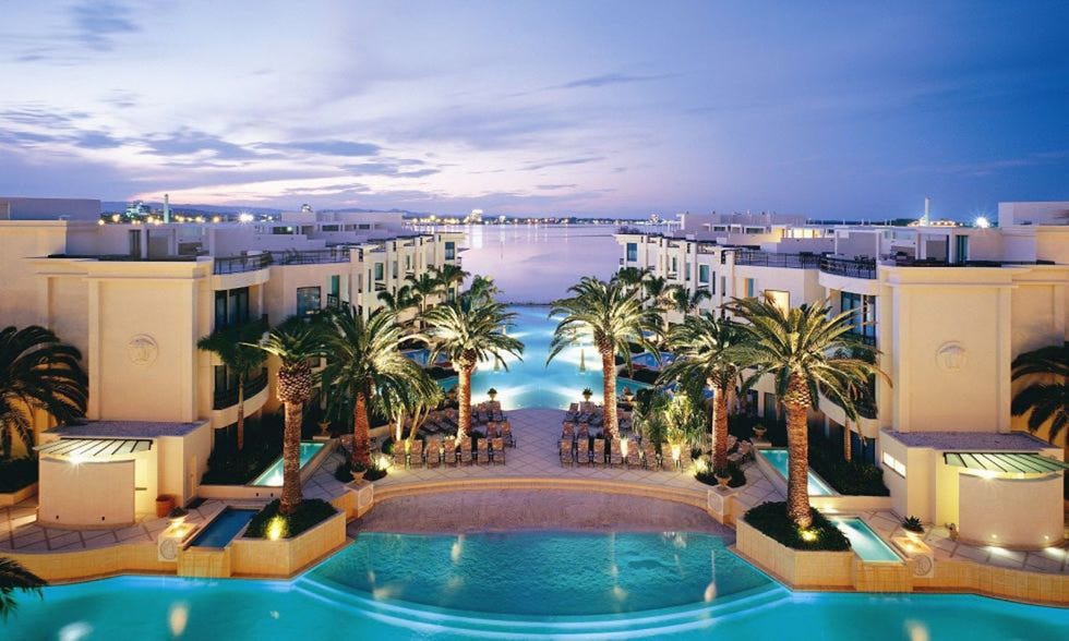 Swimming pool, Resort, Real estate, Arecales, Aqua, Azure, Flowering plant, Seaside resort, Majorelle blue, Apartment, 
