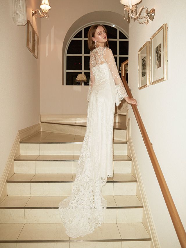 Lighting, Stairs, Sleeve, Dress, Shoulder, Bridal clothing, Textile, Photograph, White, Gown, 