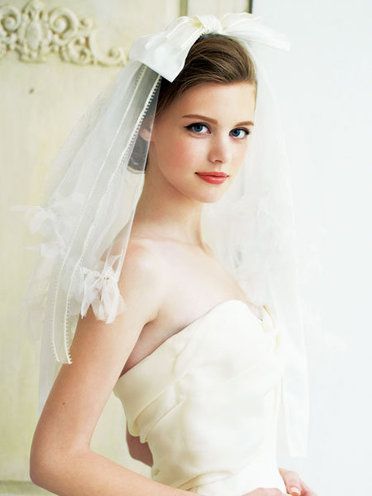 Clothing, Bridal clothing, Skin, Sleeve, Bridal veil, Shoulder, Veil, Eyebrow, Textile, Bridal accessory, 