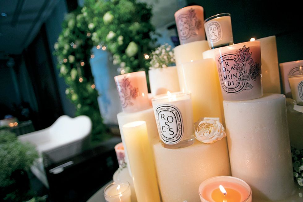 Lighting, Wax, Candle, Peach, Material property, Interior design, Cylinder, Candle holder, Flameless candle, Flame, 